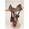 Image 1 : U.S. McClellan Saddle with an 11-1/2” seat in overall good condition with wood stirrups and leather 