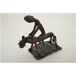 African art work of beaded man on a horse showing some age. Est.: $100-$300.