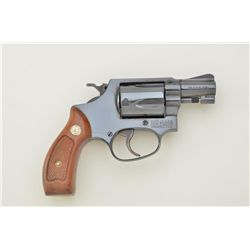 Smith & Wesson Model 36, 38 Special cal., 2” barrel, blue finish, checkered wood medallion grips, #J