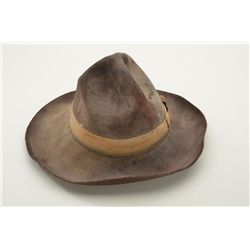 Unmarked brown felt cowboy hat with wide sweat band in overall good condition and the type a cowboy 