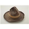 Image 2 : Unmarked brown felt cowboy hat with wide sweat band in overall good condition and the type a cowboy 