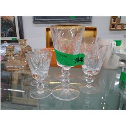 7 Pinwheel crystal glasses of assorted sizes