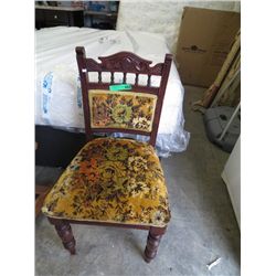 Carved back chair with upholstered seat
