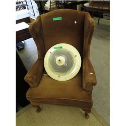 Upholstered brown wing back chair