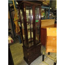 Glass display cabinet with lit interior
