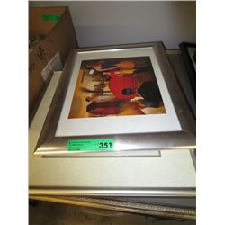 Stack of framed pictures