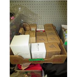 Box of collectible Avon ornaments in boxes