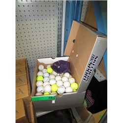 Box of used golf balls and tees