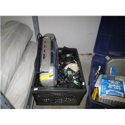 Crate of electrical adapters and a boom box