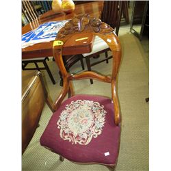 A pair of antique carved back chairs