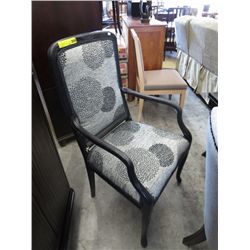 Two black upholstered accent chairs