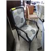 Image 1 : Two black upholstered accent chairs
