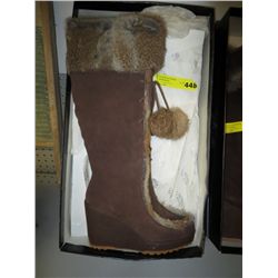 Pair of new wedge heel winter boots