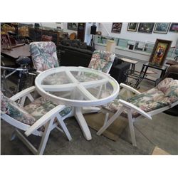 Plastic clear top patio table and four chairs