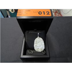 White jade dragon motif carved pendant