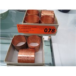 Seven copper napkin rings