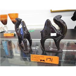 A pair of vintage ceramic camels