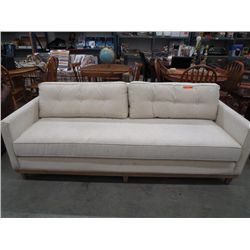 Cream coloured contemporary sofa