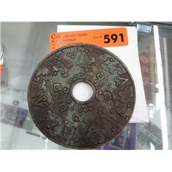 Carved soapstone disk. 4.75" dia