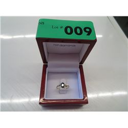 10kt gold sapphire ring set with 4 diamonds.
