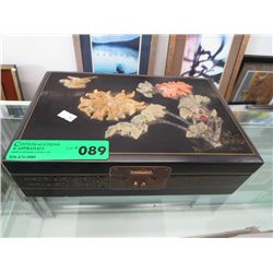 Black jewelry box, carved on top