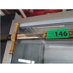 Replica sword in a leather scabbard