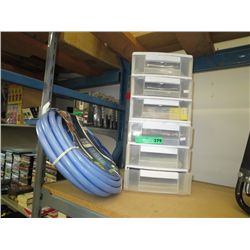 Six plastic trays and contents & garden hose