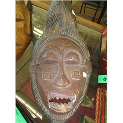 Carved wooden wall mask 17" x 10"