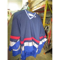 Three jerseys, assorted sizes
