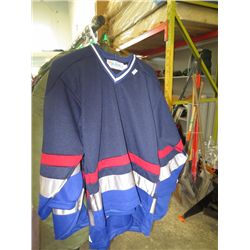 Three jerseys, assorted sizes
