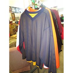 Three jerseys, assorted sizes