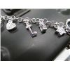 Image 2 : Charm bracelet with ten charms