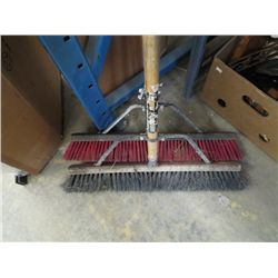 A pair of push brooms