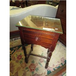 Beside table with glass covered top
