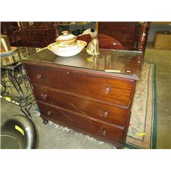 Three drawer dresser with glass covered top