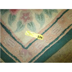 Pink and green area rug 5' x 8'