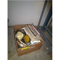 Box of vintage items and movie prop license plates