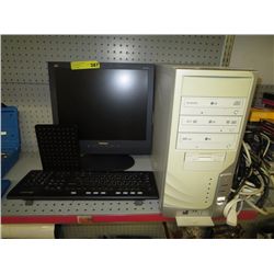 Computer tower, monitor and keyboard