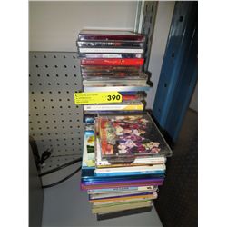 4 dozen CDs, DVDs, mostly Chinese