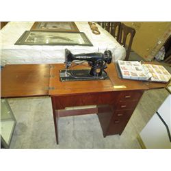 Vintage Singer sewing machine in stand