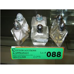Three sets of hand cut salt and peppers
