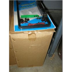 Case of 12 license plate frames with backup alarms