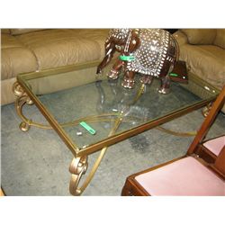 Glass top coffee table with gold painted base