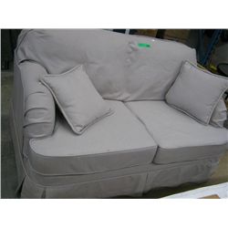 Slip covered love seat