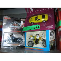 Three model cars and motorcycles