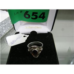 Silver and topaz ring