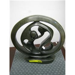 Heavy carved soapstone statue.