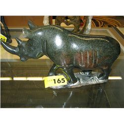 Carved stone rhinoceros statue