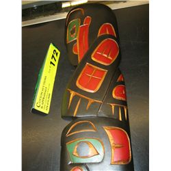 Carved native plaque of a raven