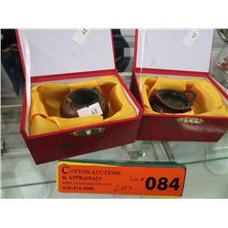 Two small cast metal decorative pots